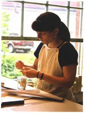 Amy Morris Pickens at work binding a book